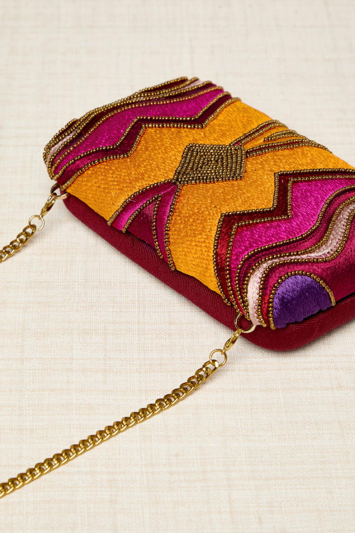BOLSO CLUTCHE BORDADO ROSA NARANJA