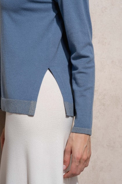 SUÉTER DE PUNTO DE LÚREX CON CUELLO EN V